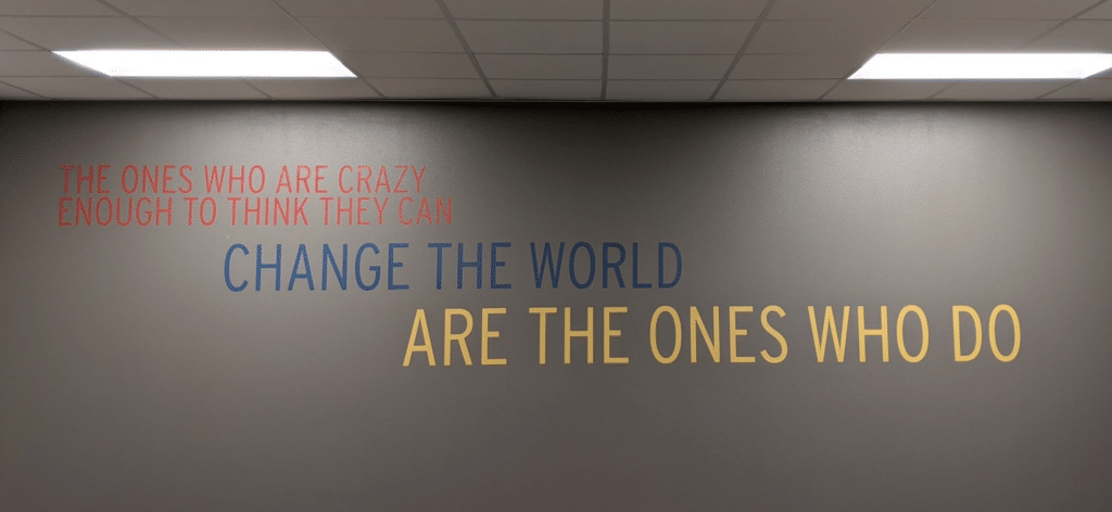 Brand + Culture Interior Signage and Environmental Graphics Cowtown Change the World 2048x944 1